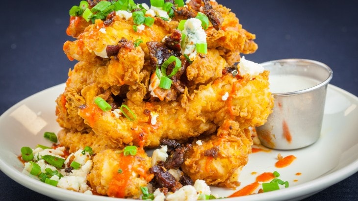 Crispy fried chicken stacked with toppings