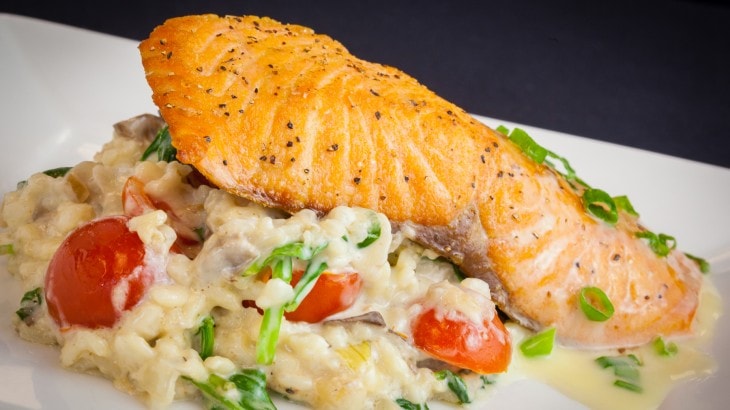 Seared salmon fillet with risotto vegetables